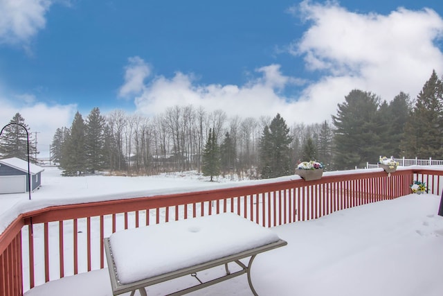 view of snow covered deck