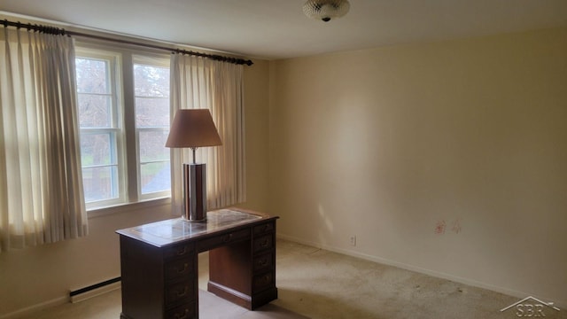 carpeted office with a baseboard radiator