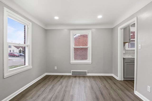 empty room with light hardwood / wood-style floors