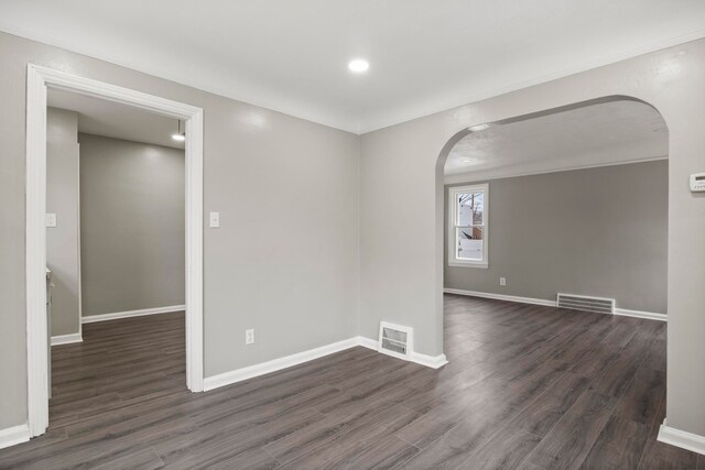 unfurnished room with dark hardwood / wood-style floors