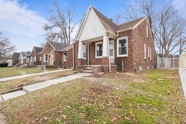 bungalow with a front yard