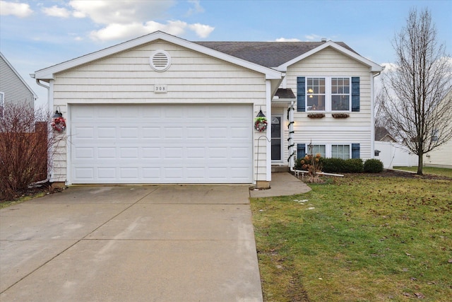 view of front of house with a front lawn and a garage