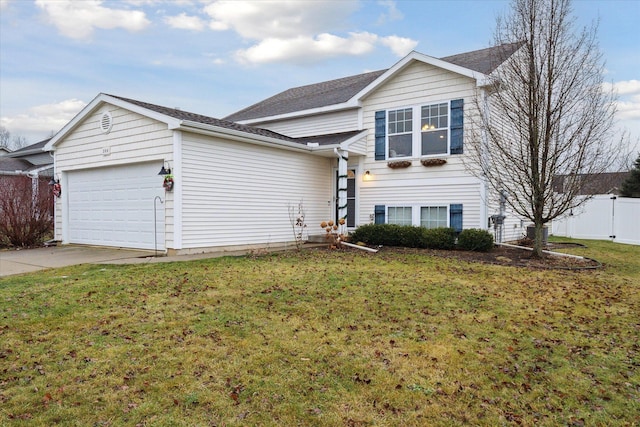 view of front of house with a garage and a front yard