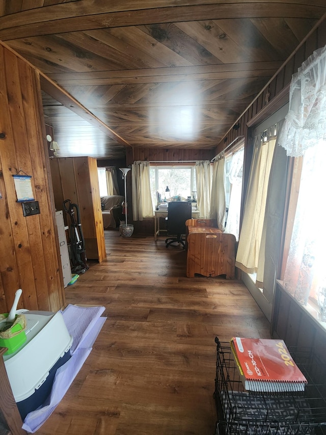 interior space featuring wood walls, dark hardwood / wood-style flooring, and wood ceiling