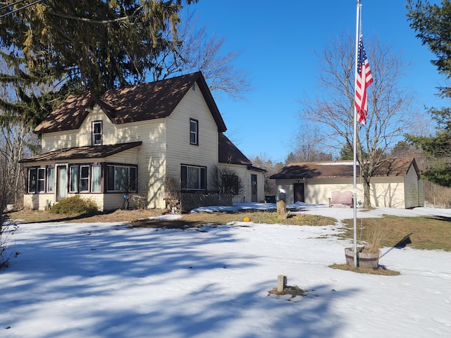 view of front of house with an outbuilding