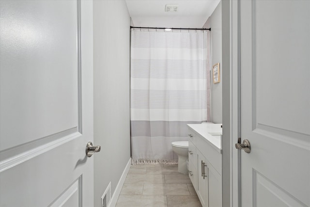 bathroom with toilet, vanity, tile patterned floors, and a shower with shower curtain