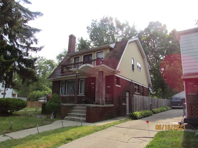 view of front of property with a balcony