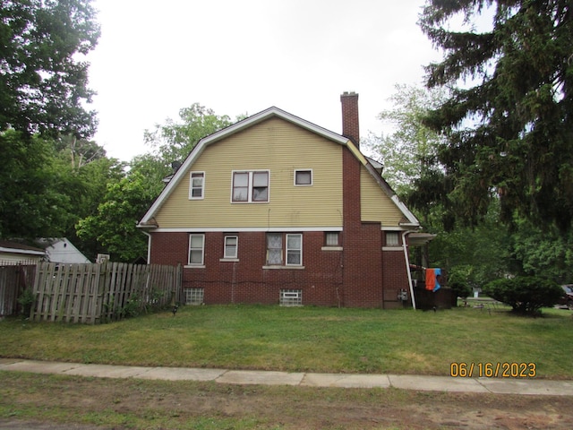 view of home's exterior featuring a lawn