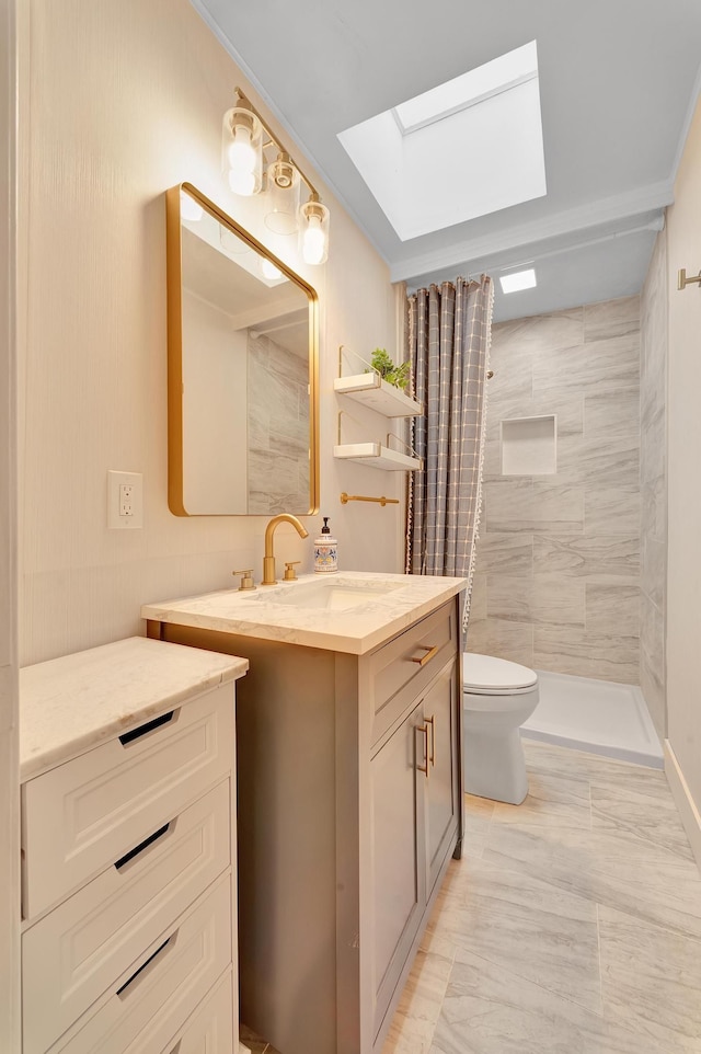 bathroom with vanity, curtained shower, toilet, and a skylight