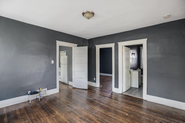 unfurnished room featuring dark hardwood / wood-style floors