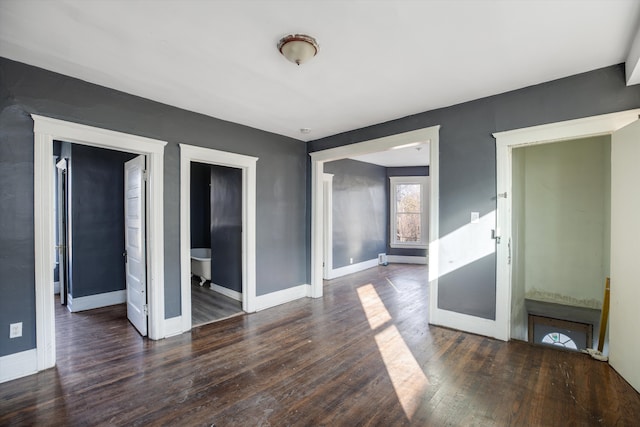 spare room with dark wood-type flooring