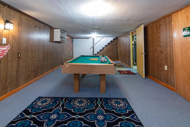 recreation room with wood walls, carpet floors, and pool table