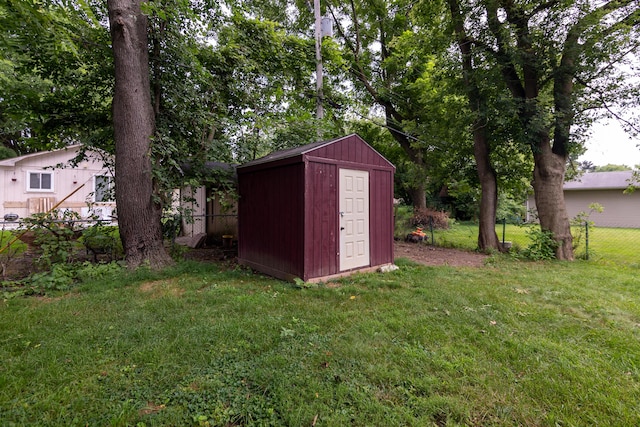 view of outbuilding featuring a yard