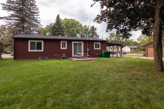 back of house with a patio, a yard, and central AC