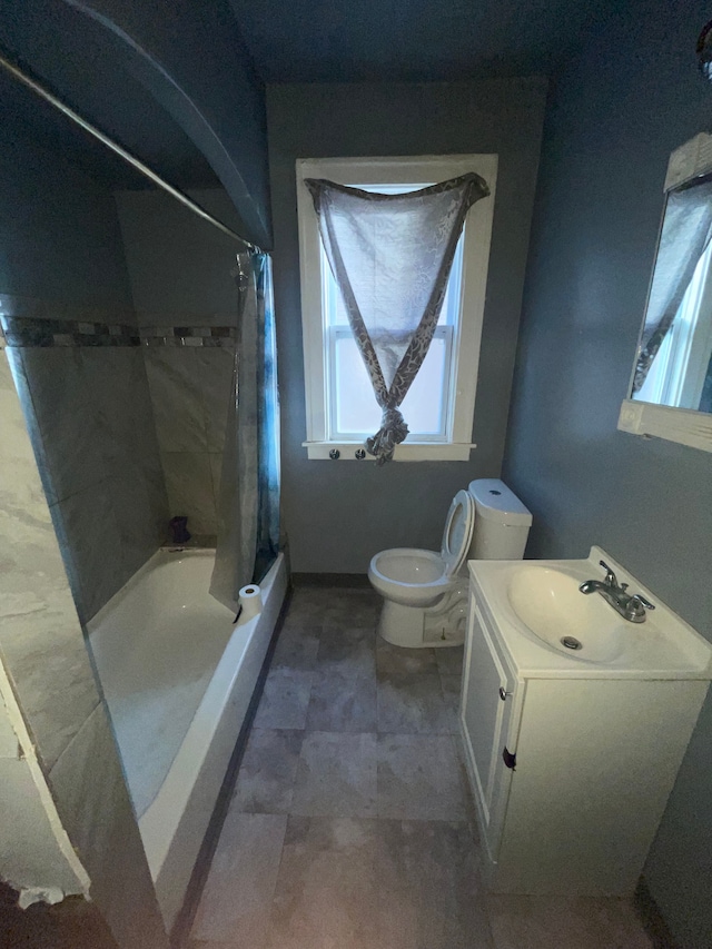 full bathroom featuring vanity, shower / bath combination with curtain, and toilet