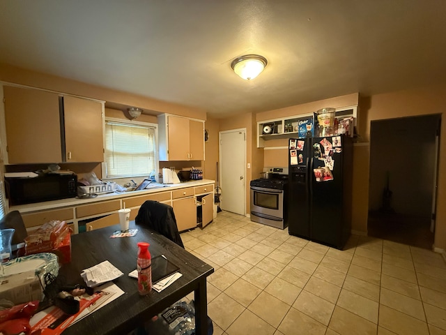 kitchen with light tile patterned flooring and black appliances