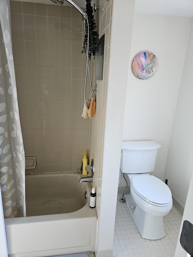 bathroom with tile patterned floors, toilet, and shower / bath combo with shower curtain