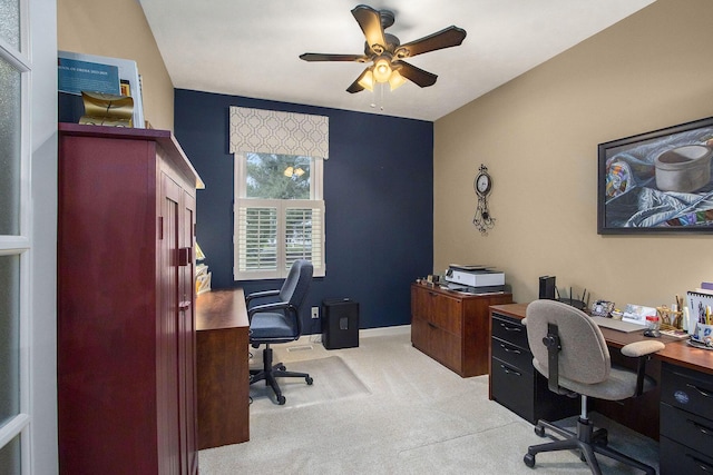 office space featuring ceiling fan and light colored carpet