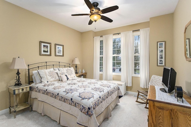 bedroom featuring ceiling fan and light colored carpet