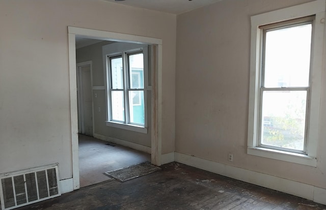 1872 Commerce St, Muskegon, MI 49441 - empty room featuring healthy amount of natural light