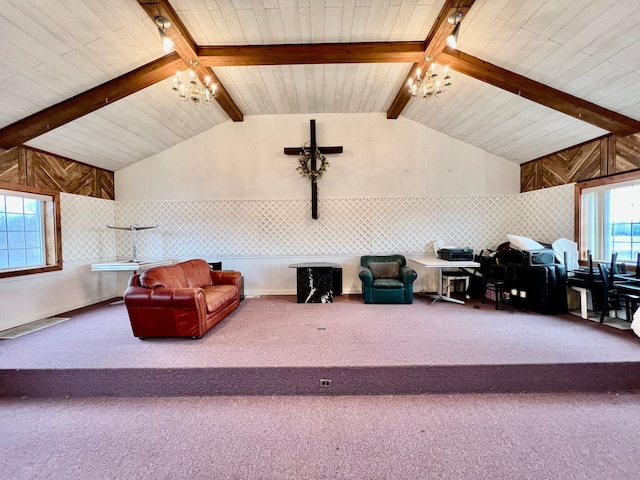 carpeted living room with a chandelier and vaulted ceiling with beams