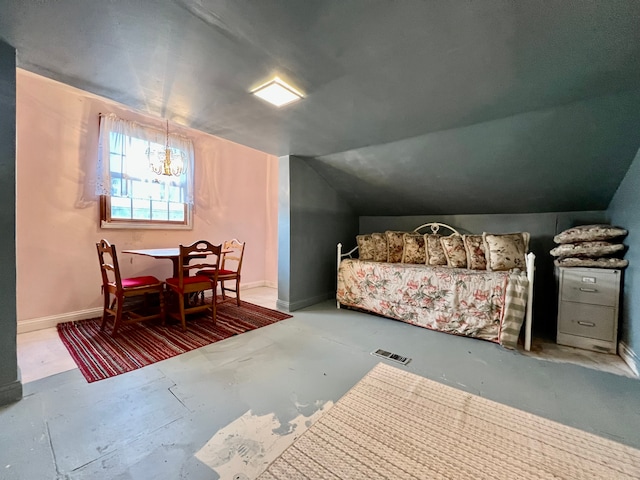 bedroom featuring concrete floors, lofted ceiling, and a notable chandelier