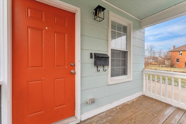 property entrance with covered porch