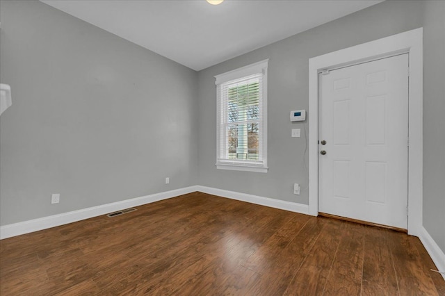 foyer entrance with dark wood-type flooring