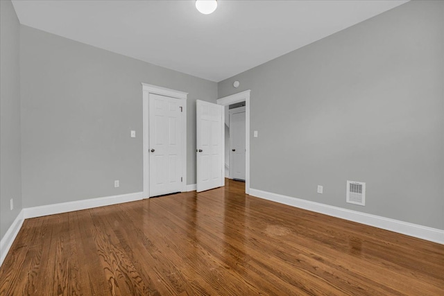 unfurnished bedroom featuring wood-type flooring