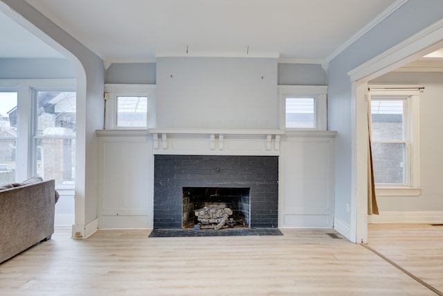 details with a fireplace, hardwood / wood-style flooring, and ornamental molding