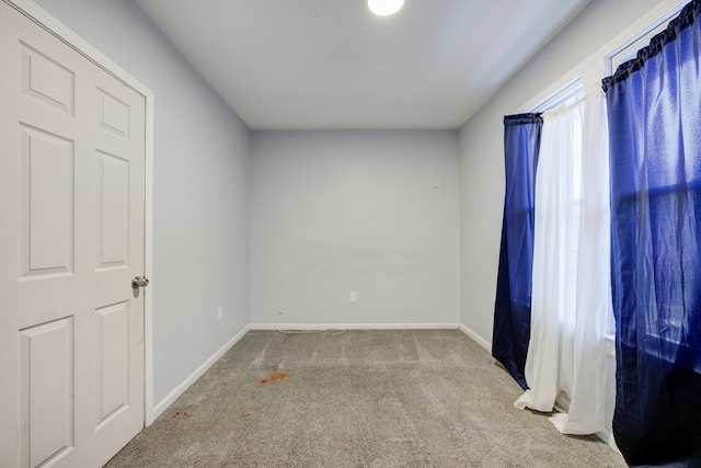 spare room featuring carpet