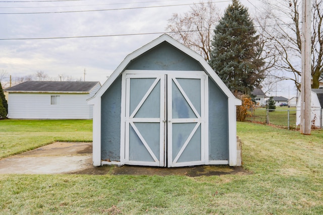 view of outdoor structure with a lawn