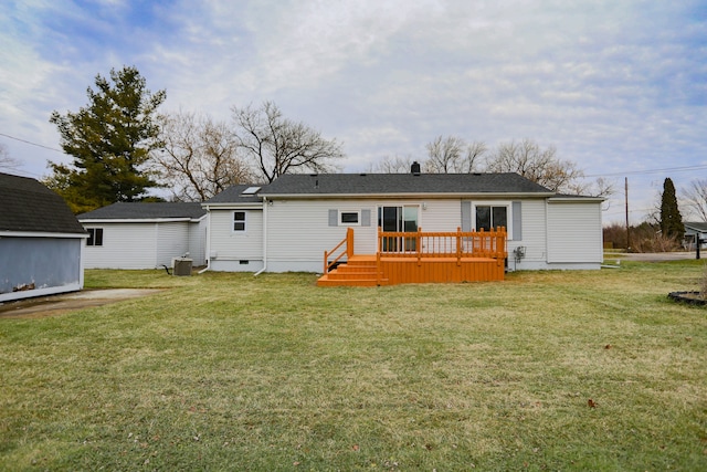 rear view of house featuring a lawn, central AC, and a deck