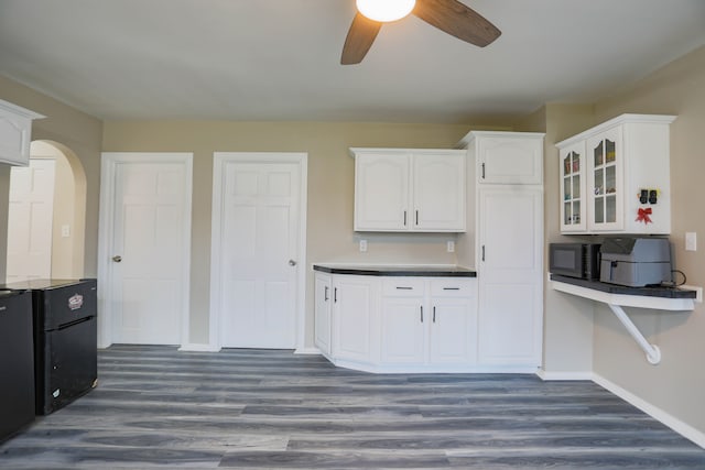 kitchen with ceiling fan, dark hardwood / wood-style flooring, and white cabinets