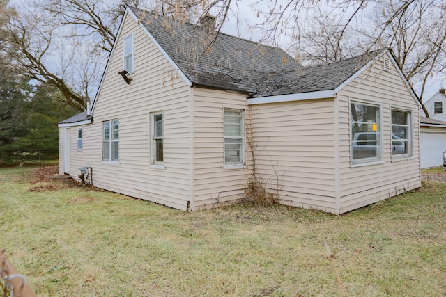 view of property exterior with a yard