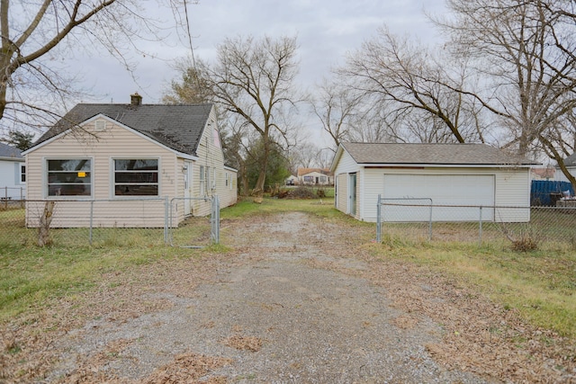 view of home's exterior with an outbuilding and a garage