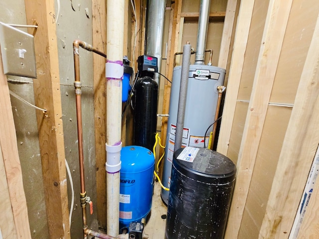 utility room featuring gas water heater