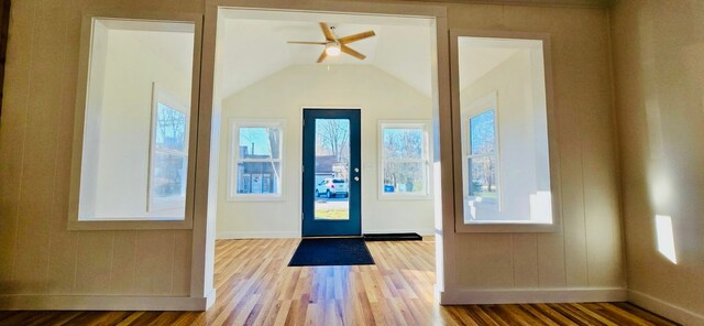 entryway featuring wood-type flooring, vaulted ceiling, and ceiling fan