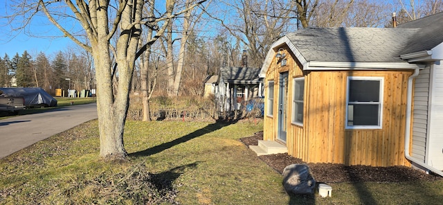 view of property exterior with a lawn