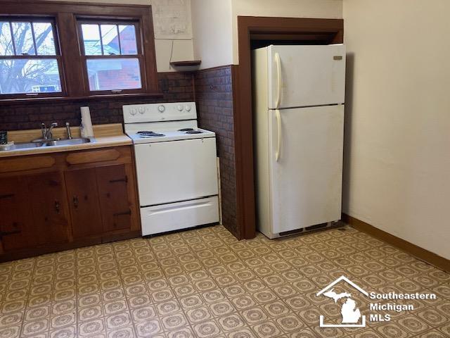 kitchen with white appliances and sink