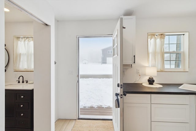 bathroom featuring vanity and hardwood / wood-style flooring