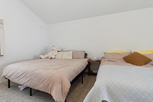 carpeted bedroom with lofted ceiling