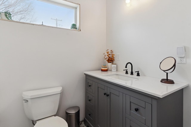 bathroom with toilet and vanity