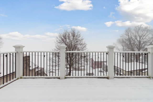 view of snow covered gate