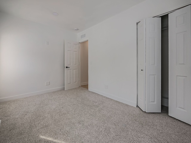 unfurnished bedroom featuring carpet