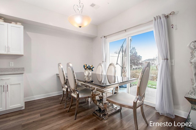 dining room featuring dark hardwood / wood-style flooring