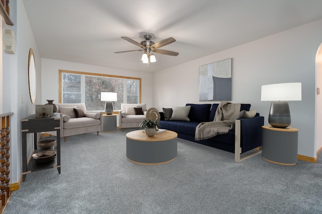 carpeted living room featuring ceiling fan