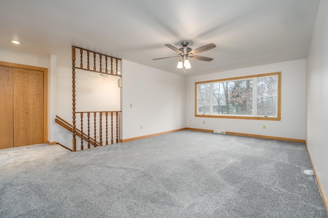 carpeted empty room with ceiling fan