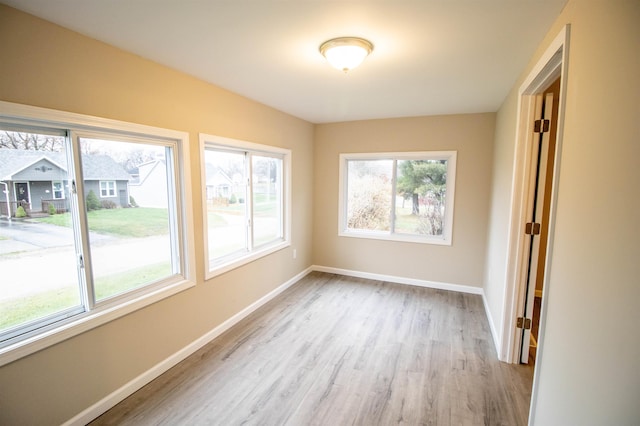 spare room featuring light hardwood / wood-style floors