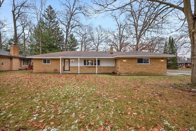 rear view of house with covered porch